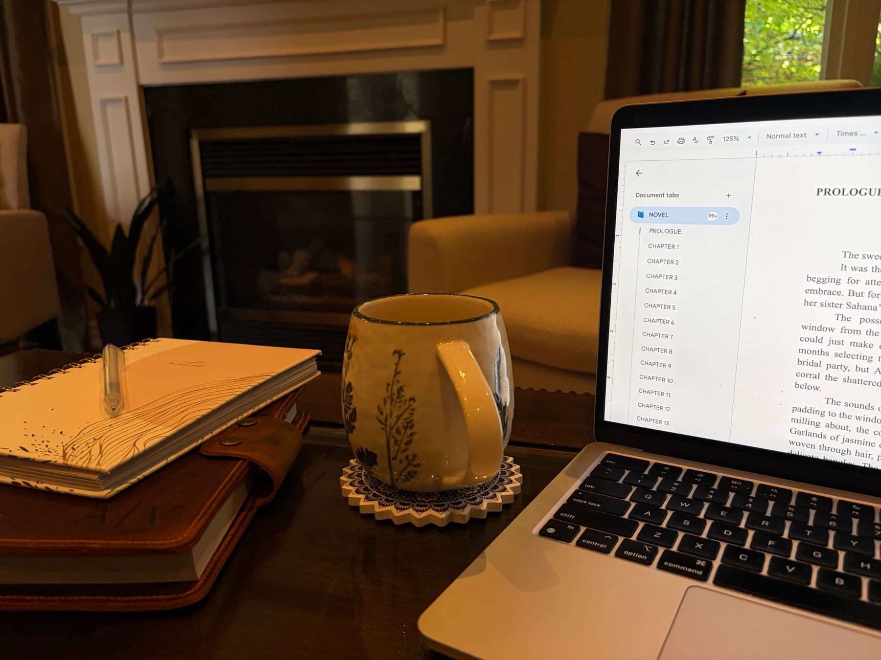 Laptop open to a novel draft in a cozy living room.